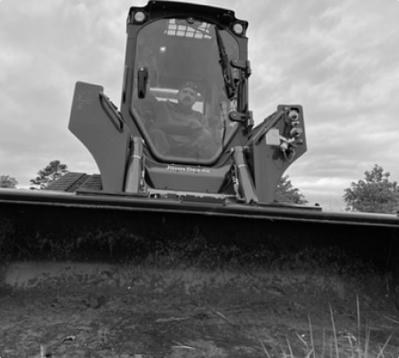 Man on a skid steer